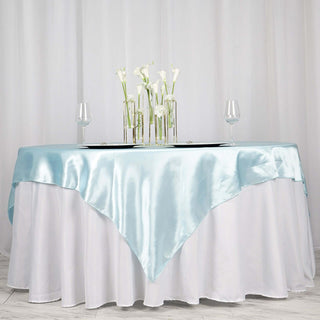 Create Unforgettable Memories with our Light Blue Satin Tablecloth Overlay Create Unforgettable Memories with our Light Blue Satin Tablecloth Overlay