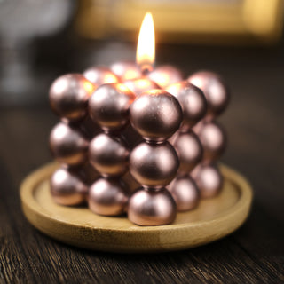 Add Elegance with the Metallic Rose Gold Bubble Cube Candle