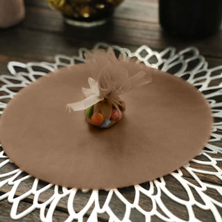 Brown decorative round table mat with a small fabric pouch on top.