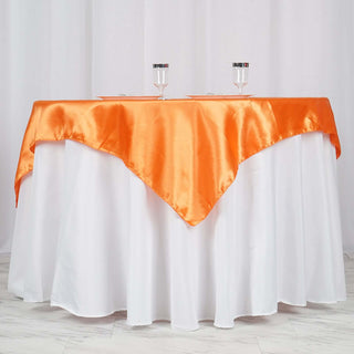 Elevate Your Event Decor with the Orange Square Smooth Satin Table Overlay Elevate Your Event Decor with the Orange Square Smooth Satin Table Overlay