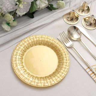 Gold decorative plate on a table setting with cutlery and glasses.