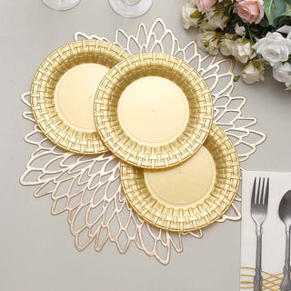 Three elegant gold plates on a decorative lace placemat.