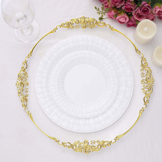 Elegant white plates with gold ornate trim on a plain background.