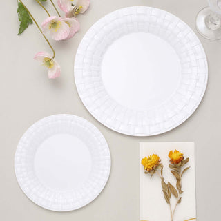 White decorative plates in two sizes with floral accents