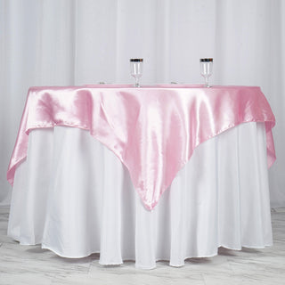 Create a Festive Atmosphere with our Pink Satin Table Overlay