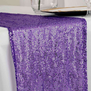 Purple sequin table runner draped elegantly over a white table.