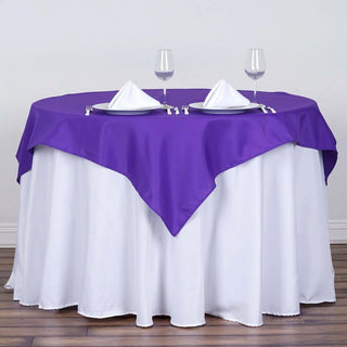 Add Elegance to Your Event with the 54"x54" Purple Square Polyester Table Overlay Add Elegance to Your Event with the 54"x54" Purple Square Polyester Table Overlay