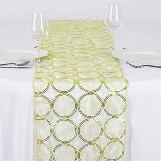 Green and gold circular patterned table runner on a white table