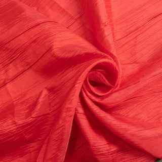 Textured coral fabric showcasing elegant draping and sheen.
