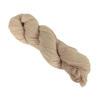 Natural beige fabric yarn skein on a white background