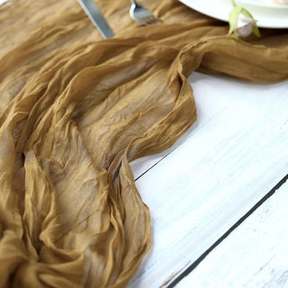 Brown textured fabric draped elegantly on a table with a plate and cutlery.