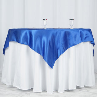 Create a Festive Atmosphere with the Royal Blue Square Smooth Satin Table Overlay