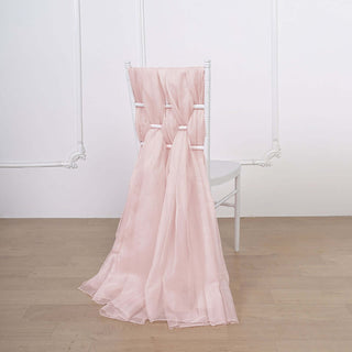 Pink sheer fabric draped over a white chair in a minimalist setting.