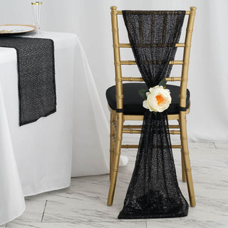 Elegant black chair sash with rose decoration on a gold chiavari chair.