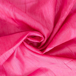 Bright pink textured fabric swirl, showcasing lustrous sheen and vibrant color.
