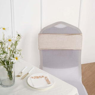 Elegant chair cover with gold detailing in a dining setting.