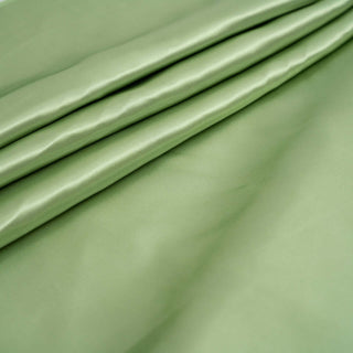 Soft green fabric with smooth texture and subtle sheen.