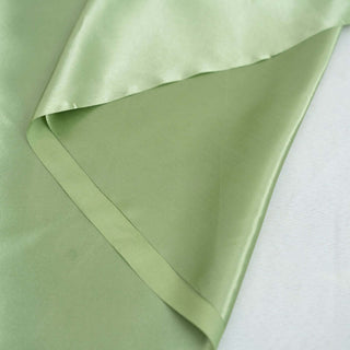 Soft green satin fabric with smooth texture and elegant sheen.