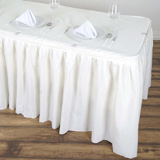 Create a Luxurious Atmosphere with the Ivory Pleated Polyester Table Skirt Create a Luxurious Atmosphere with the Ivory Pleated Polyester Table Skirt