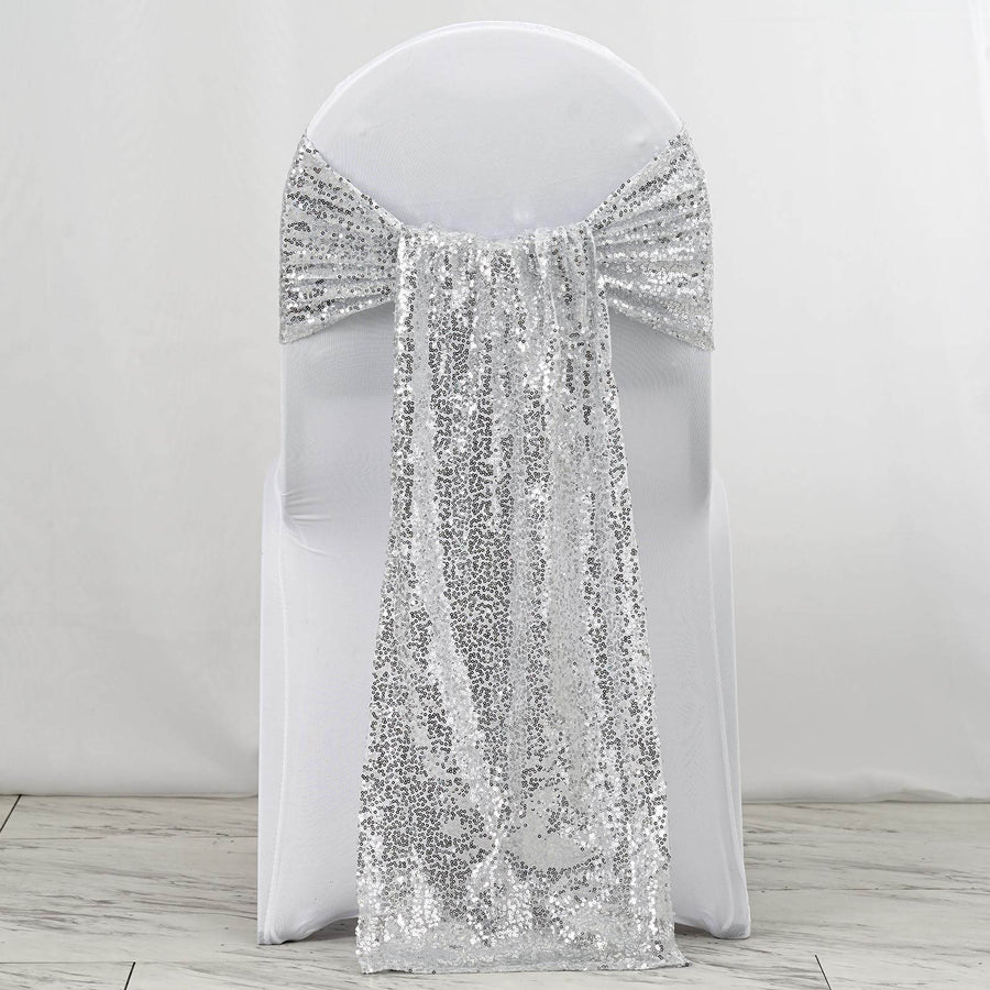Silver sequin chair sash draped elegantly on a white chair