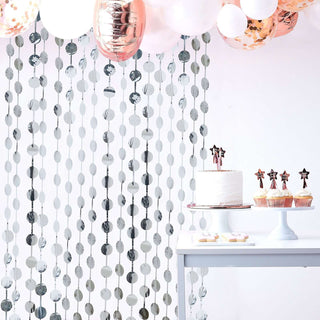 Create an Unforgettable Party Backdrop with the Silver Round Chain Foil Fringe Curtain Create an Unforgettable Party Backdrop with the Silver Round Chain Foil Fringe Curtain
