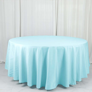 Round light blue tablecloth on a plain white backdrop.
