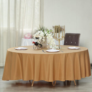 Dazzle Your Guests with the 108" Gold Seamless Polyester Round Tablecloth