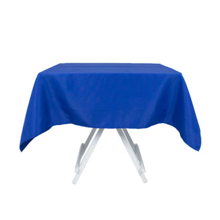 Blue tablecloth draped over a folding table on a white background.
