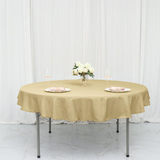 Elevate Your Event Decor with the 70" Round Champagne Seamless Polyester Linen Tablecloth