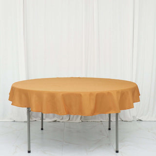 Round mustard tablecloth on a folding table