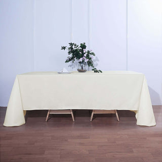 Elevate Your Event with the Ivory Seamless Polyester Rectangular Tablecloth Elevate Your Event with the Ivory Seamless Polyester Rectangular Tablecloth
