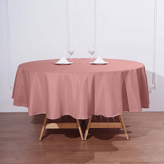 Add Elegance to Your Event with the 90" Dusty Rose Polyester Round Tablecloth Add Elegance to Your Event with the 90" Dusty Rose Polyester Round Tablecloth