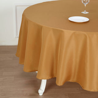 Create an Unforgettable Event with the 90" Gold Seamless Polyester Round Tablecloth