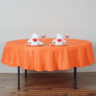 Add Vibrance to Your Events with the 90" Orange Seamless Polyester Round Tablecloth