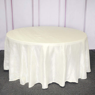 Elevate Your Event with the Ivory Seamless Accordion Crinkle Taffeta Round Tablecloth Elevate Your Event with the Ivory Seamless Accordion Crinkle Taffeta Round Tablecloth