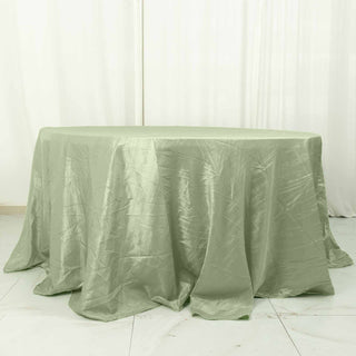 Elevate Your Event with the Sage Green Seamless Accordion Crinkle Taffeta Round Tablecloth