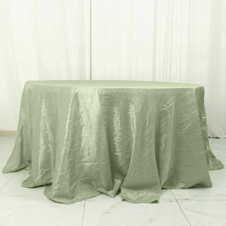 Round green tablecloth draped elegantly over a table.