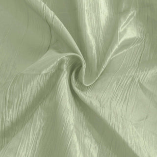 Green textured fabric with a silky sheen.
