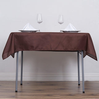 Enhance Your Table Setting with the 54"x54" Chocolate Square Seamless Polyester Table Overlay