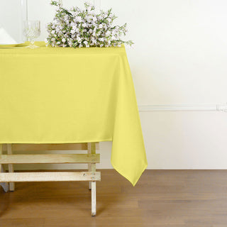 Elevate Your Event with the Stunning 54"x54" Yellow Square Seamless Polyester Tablecloth