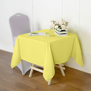 Brighten up your Event with the 54"x54" Yellow Square Seamless Polyester Tablecloth