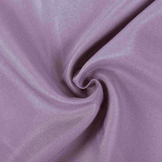 Purple fabric texture swirl close-up shot.