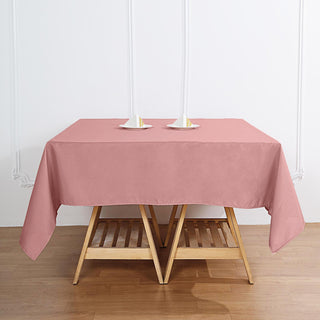 Add Elegance to Your Event with the 70"x70" Dusty Rose Square Seamless Polyester Tablecloth