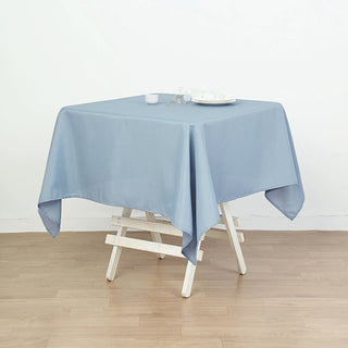 Add Elegance to Your Event with the Dusty Blue Square Seamless Polyester Table Overlay