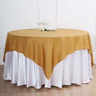 Create a Luxurious Atmosphere with the 70"x70" Gold Square Polyester Table Overlay Create a Luxurious Atmosphere with the 70"x70" Gold Square Polyester Table Overlay