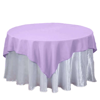 Purple round tablecloth draped over a silver table skirt.