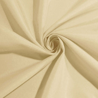 Beige fabric swirl texture close-up shot.