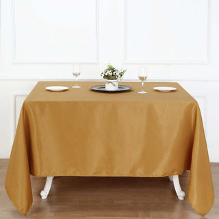 Elegant gold tablecloth draped over a dining table set for dinner.