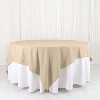Beige round tablecloth on a white table.