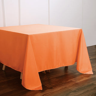 Add a Pop of Color with the 90x90 Orange Seamless Square Polyester Tablecloth